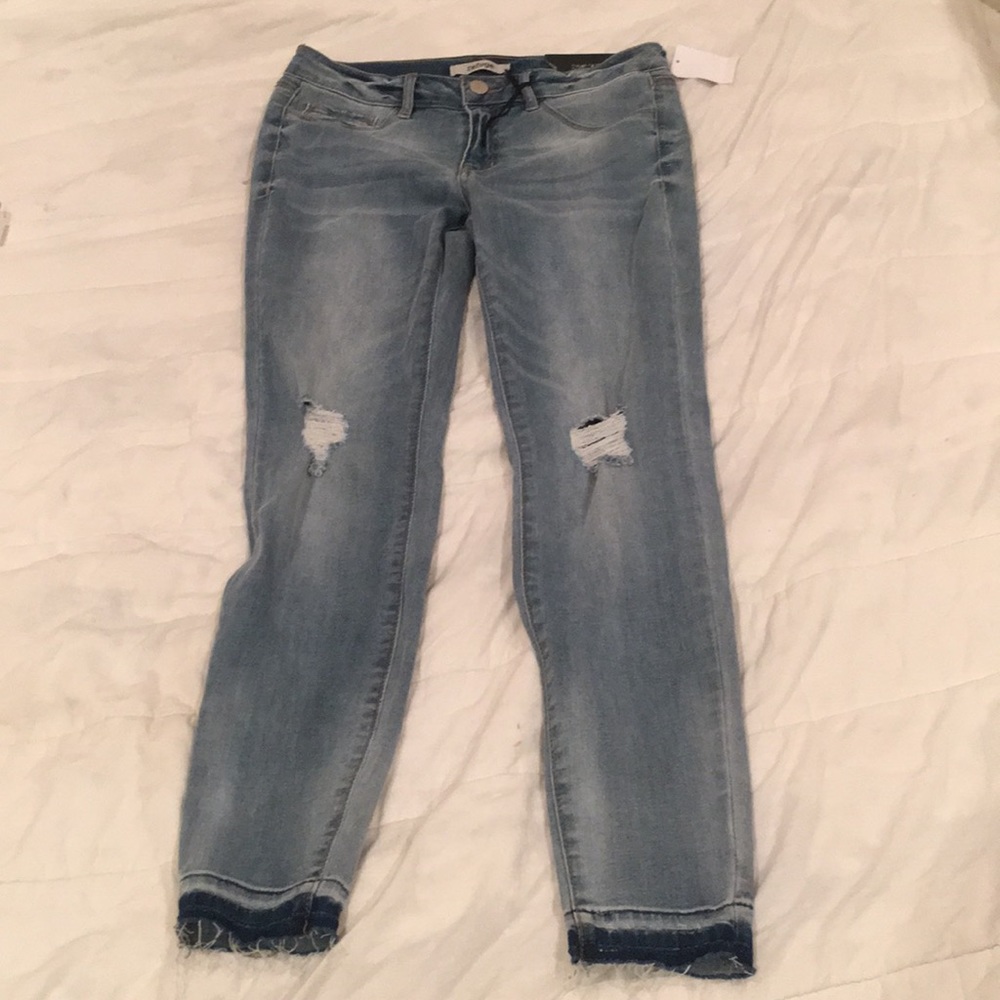 Skinny denim blue jeans. Never worn. Size 6.